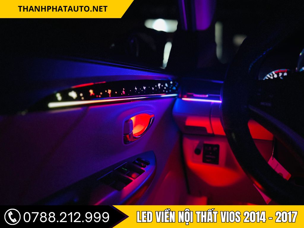 Hình ảnh kĩ thuật viên đang lắp đèn lep viền nội thất tại trung tâm phụ kiện ô tô tại Biên Hòa, hiển thị giao diện điều khiển hiện đại trong khoang nội thất xe.